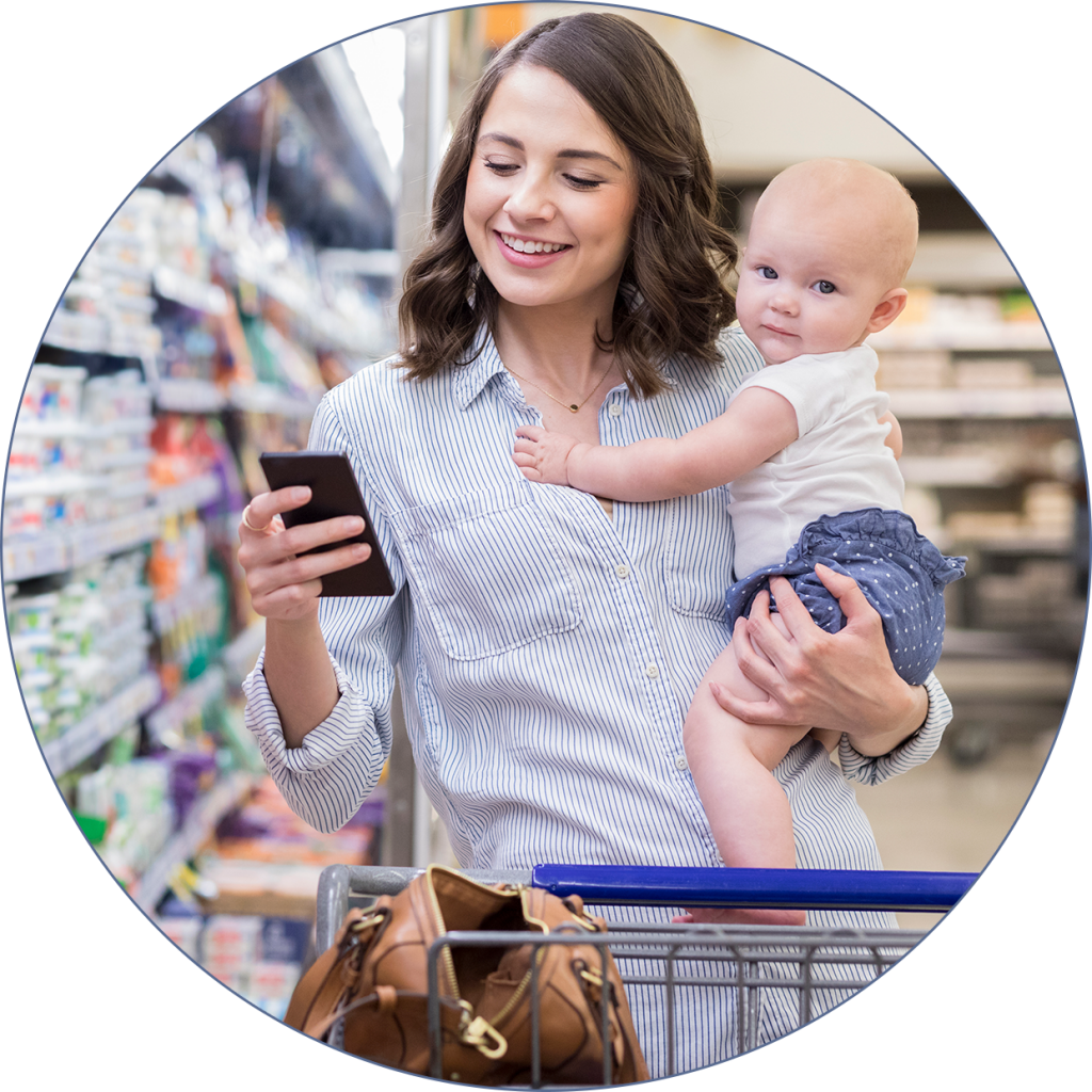woman using gapwallet discounts in store with her child woman using gapwallet discounts in store with her child
